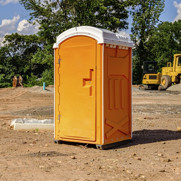 what is the cost difference between standard and deluxe portable restroom rentals in Hodgeman County